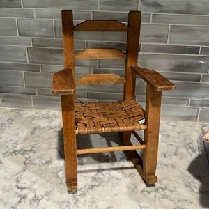 Doll’s wood and wicker rocking chair